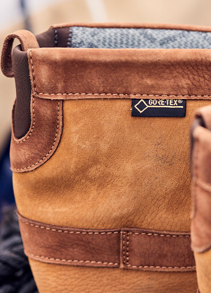 Close-up of a brown leather boot with GORE-TEX label