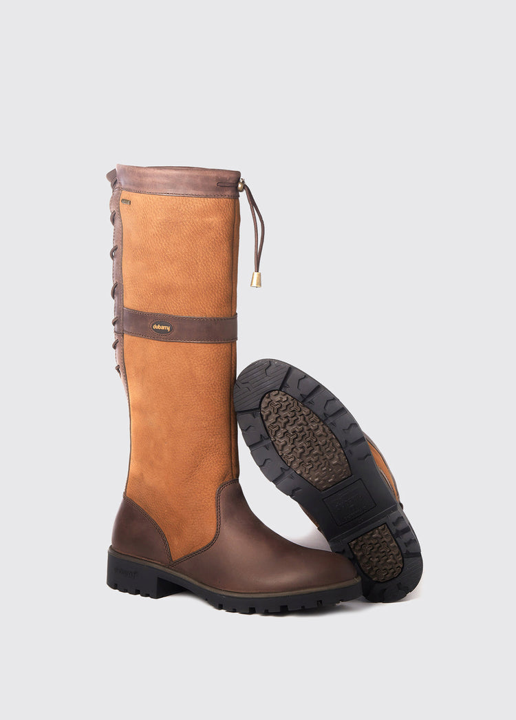 Pair of Dubarry ladies Glanmire adjustable calf Country Boot, knee high brown leather heeled boots with elasticated back and laced top, displayed to show one boot's sole