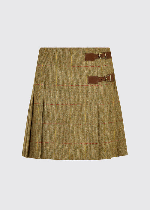 Dubarry women's Blossom Tweed Elm Skirt from the side with two buckled leather tabs and stitched down knife pleats.