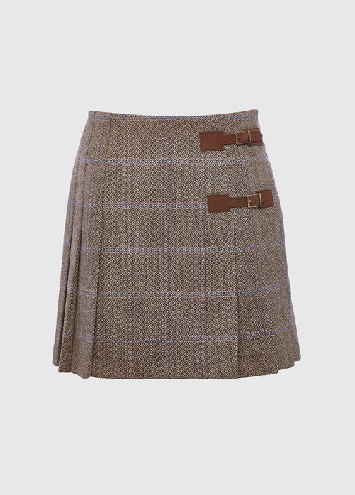 Dubarry women's Blossom Tweed Skirt in the colour WoodRose. A pleated skirt with a polo and light knit and two buckled leather tabs.