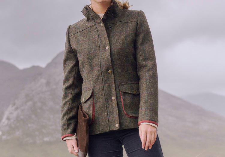 Woman modelling Dubarry women's Betony Tweed Hemlock Coat with complimentary contrasting trims on the collar, cuffs and pockets. 