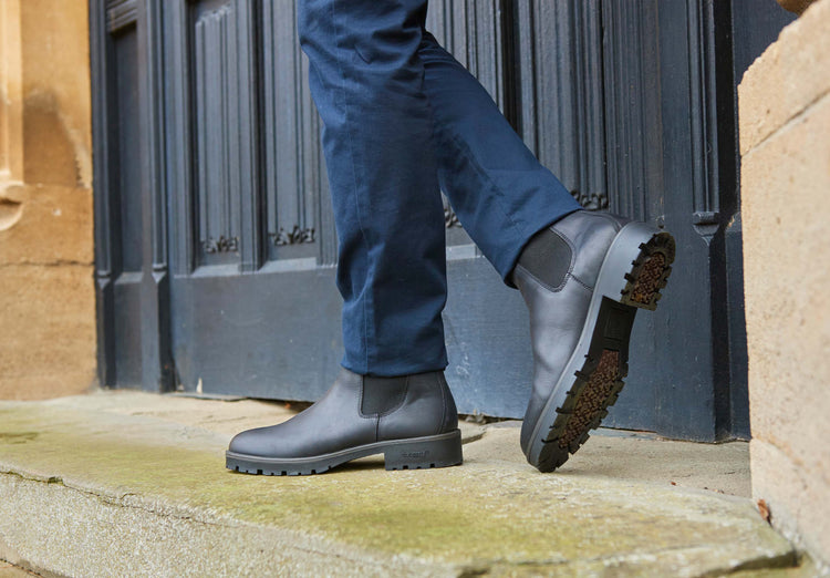 On model  image of a pair of Dubarry Antrim black leather country boots, men's Chelsea style boot