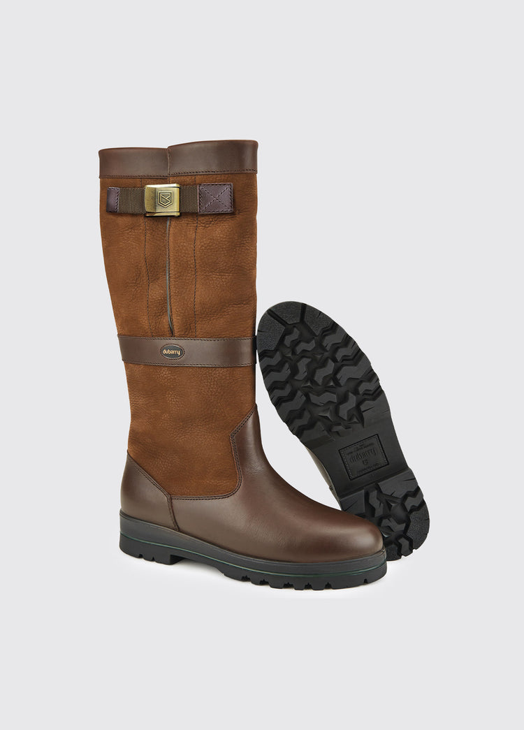A pair of Dubarry wider fitting mens Duncannon Country boots, walnut coloured calf height leather bootswith adjustable strap, boots positioned to show one boot's sole