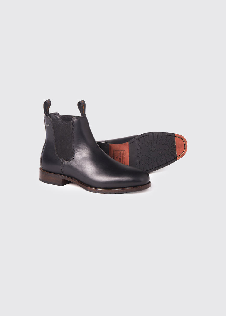 Pair of Dubarry Kerry Chelsea ankle Boots for men, black leather with elasticated side gussets with front and heel finger pulls, boots are displayed to show one boot's leather sole