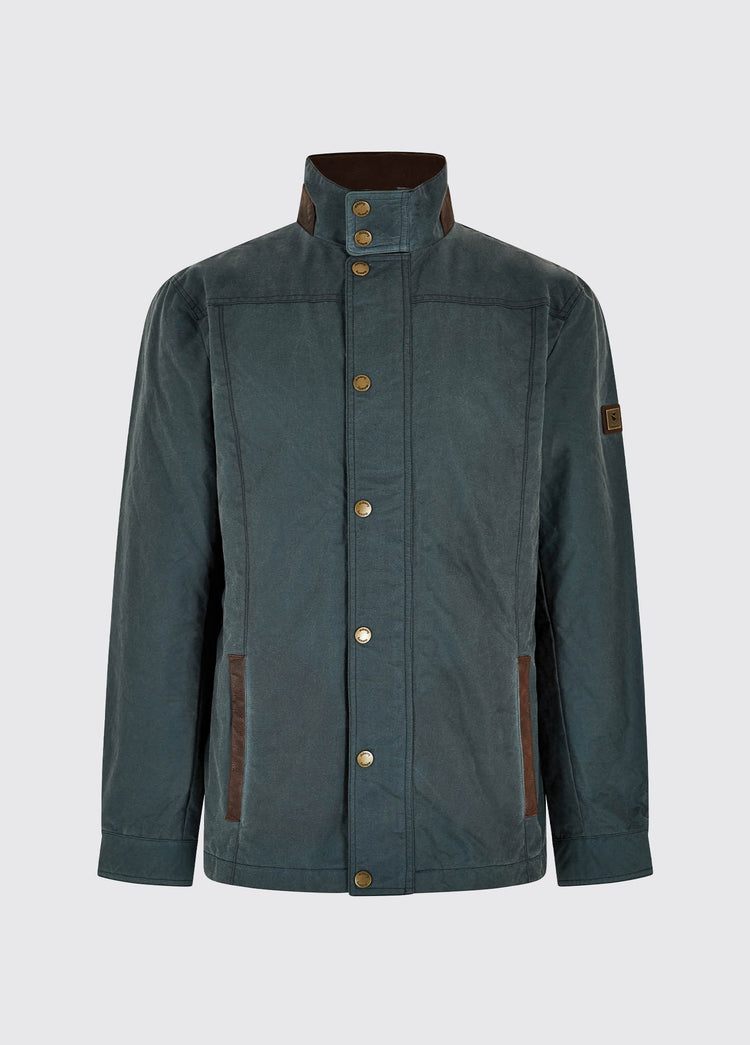Waist up view of a male model wearing a Dubarry Carrickfergus waxed jacket open, dark pebble green blue coloured with a standing collar and buttons along the full zip and lighter brown inside collar
